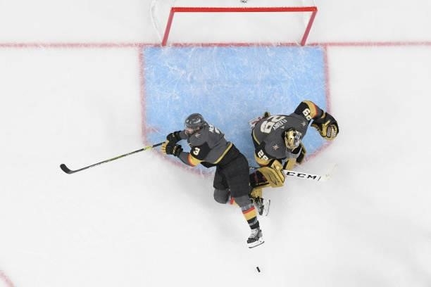 Brayden McNabb of the Vegas Golden Knights trips over teammate Marc-Andre Fleury in the third period in Game Two of the Stanley Cup Semifinals during...