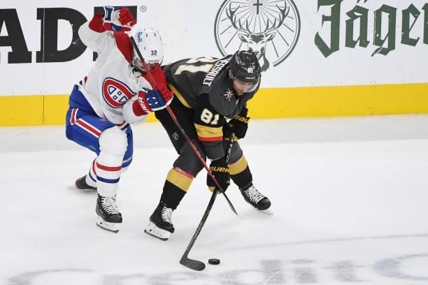 Erik Gustafsson of the Montreal Canadiens and Jonathan Marchessault of the Vegas Golden Knights fight for the puck in the second period in Game Two...