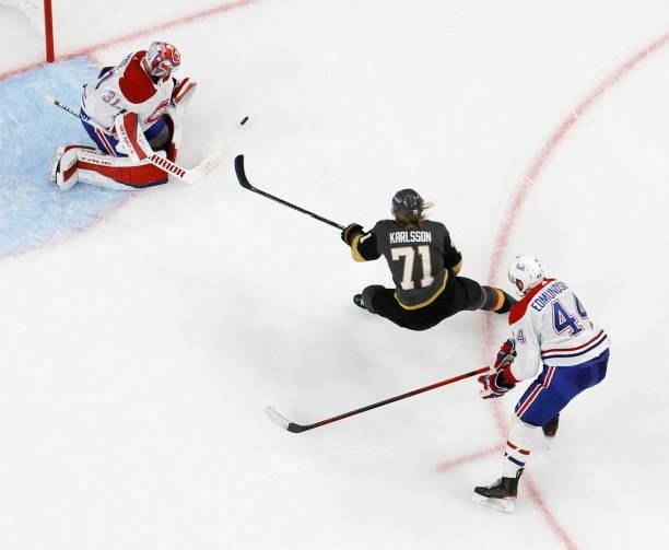 Carey Price of the Montreal Canadiens blocks a shot by William Karlsson of the Vegas Golden Knights as Joel Edmundson of the Canadiens defends in the...