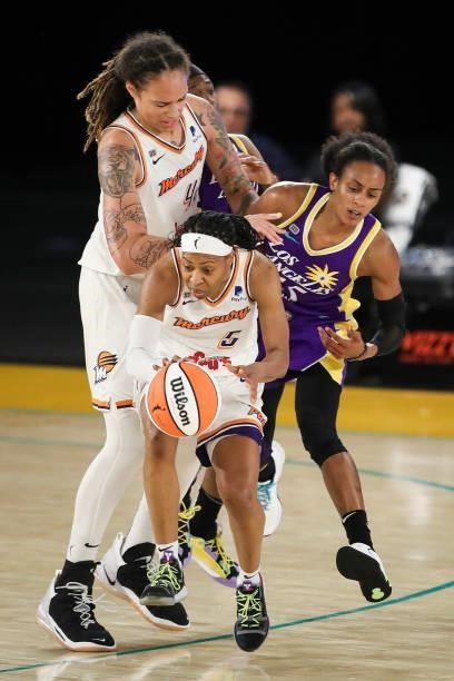 Shey Peddy of the Phoenix Mercury controls the ball as Brittney Sykes of the Los Angeles Sparks collides with Brittney Griner during the second half...