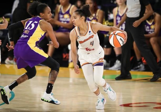 Skylar Diggins-Smith of the Phoenix Mercury controls the ball against Brittney Sykes of the Los Angeles Sparks at Los Angeles Convention Center on...