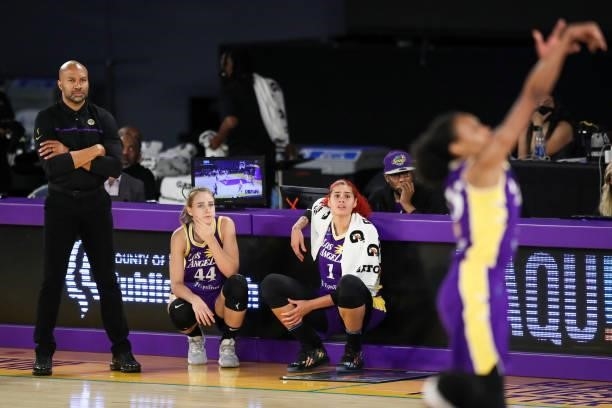 Head coach Derek Fisher, Karlie Samuelson, and center Amanda Zahui B of the Los Angeles Sparks look on during the second half against the Phoenix...