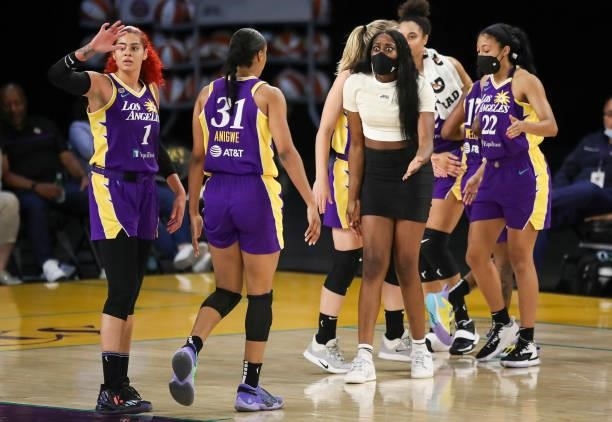 Chiney Ogwumike of the Los Angeles Sparks reacts with Kristine Anigwe during a time out in the second half of the game against the Phoenix Mercury at...