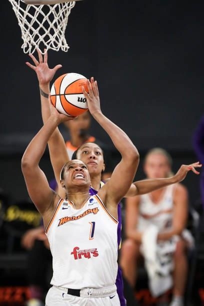 Kia Vaughn of the Phoenix Mercury shoots against Arella Guirantes of the Los Angeles Sparks in the first half at Los Angeles Convention Center on...