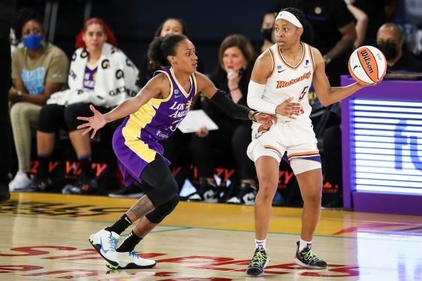 Shey Peddy of the Phoenix Mercury controls the ball against Brittney Sykes of the Los Angeles Sparks in the second half at Los Angeles Convention...