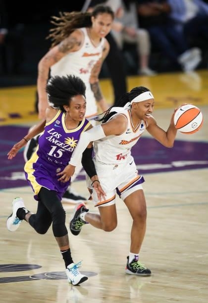 Shey Peddy of the Phoenix Mercury controls the ball against Brittney Sykes of the Los Angeles Sparks at Los Angeles Convention Center on June 16,...