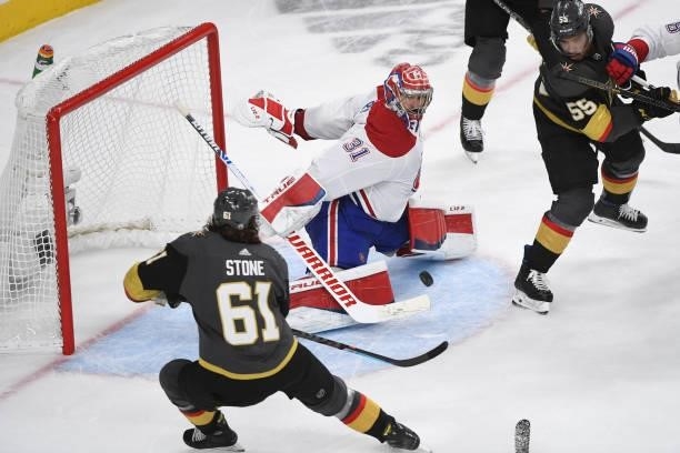 Carey Price of the Montreal Canadiens stops a shot by Mark Stone of the Vegas Golden Knights as Keegan Kolesar of the Vegas Golden Knights watches in...