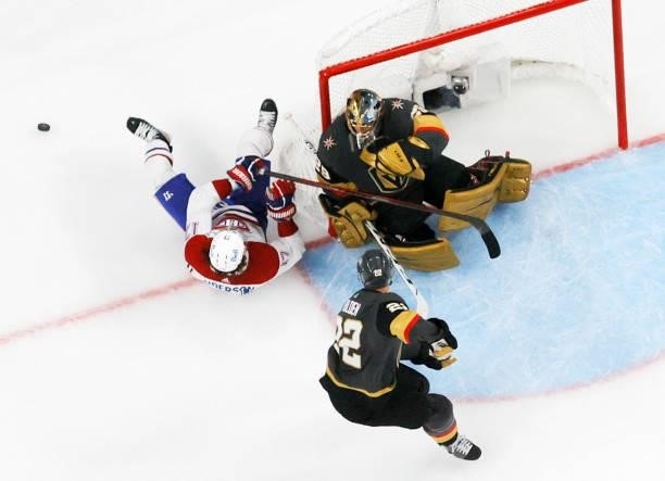 Josh Anderson of the Montreal Canadiens crashes into the net after he lost the puck while trying to get a shot off against Marc-Andre Fleury of the...