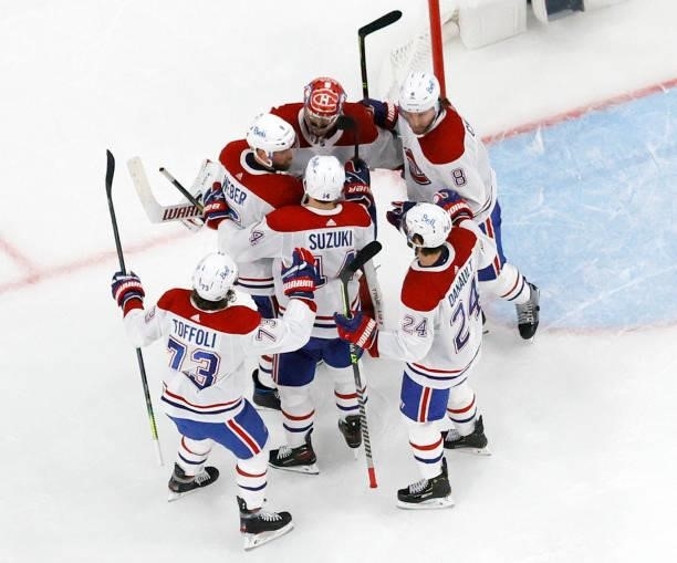 Tyler Toffoli, Shea Weber, Nick Suzuki, Phillip Danault and Ben Chiarot of the Montreal Canadiens congratulate Carey Price after the team's 3-2...