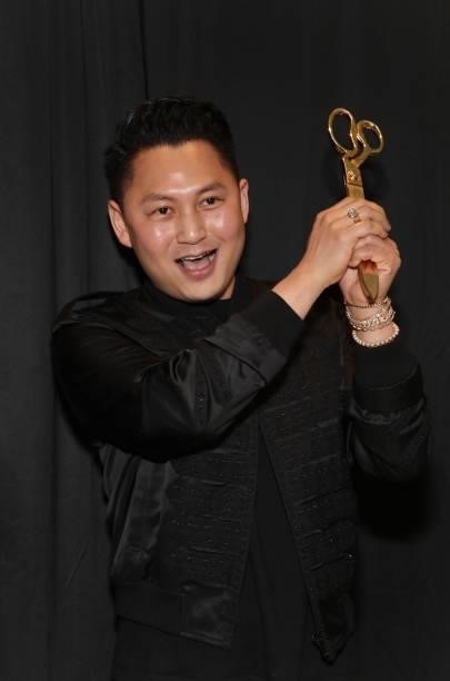 Kyle Chan cuts the ribbon at his store opening at Kyle Chan Design on June 16, 2021 in Los Angeles, California.