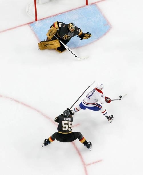 Paul Byron of the Montreal Canadiens closes in on Marc-Andre Fleury of the Vegas Golden Knights to score a second-period goal as Keegan Kolesar of...