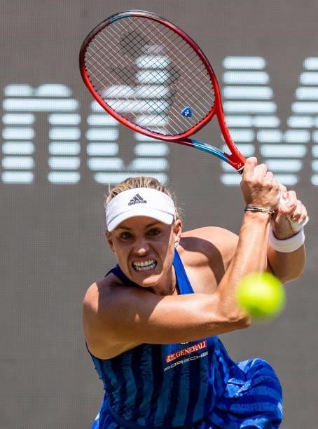 Angelique Kerber of Germany hits a backhand against Victoria Azarenka of Belarus in the women's singles second round match during day 6 of the...