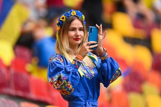 Ukraine fan takes a picture inside the stadium prior to the UEFA Euro 2020 Championship Group C match between Ukraine and North Macedonia at National...