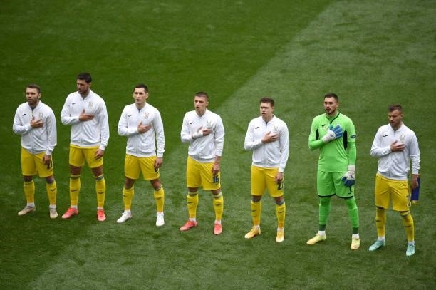 Players of Ukraine stand for the national anthem prior to the UEFA Euro 2020 Championship Group C match between Ukraine and North Macedonia at...