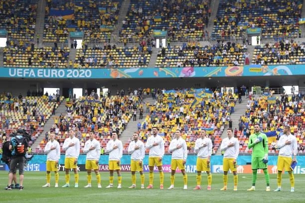 Players of Ukraine stand for the national anthem prior to the UEFA Euro 2020 Championship Group C match between Ukraine and North Macedonia at...