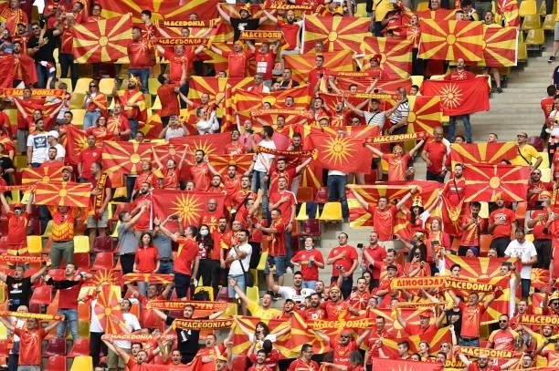 North Macedonia fans display scarves and flags as they sing the national anthem prior to the UEFA Euro 2020 Championship Group C match between...