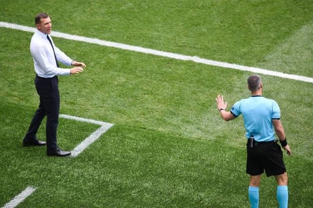 Andriy Shevchenko, Head Coach of Ukraine interacts with Fourth Official, Slavko Vincic during the UEFA Euro 2020 Championship Group C match between...
