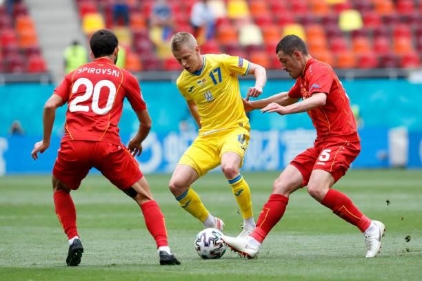 Oleksandr Zinchenko of Ukraine is challenged by Arijan Ademi of North Macedonia during the UEFA Euro 2020 Championship Group C match between Ukraine...