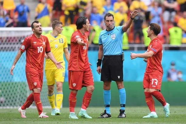 Eljif Elmas of North Macedonia interacts with Match Referee, Fernando Andres Rapallini during the UEFA Euro 2020 Championship Group C match between...