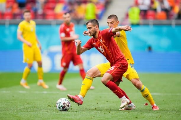 Boban Nikolov of North Macedonia is closed down by Vitaliy Mykolenko of Ukraine during the UEFA Euro 2020 Championship Group C match between Ukraine...