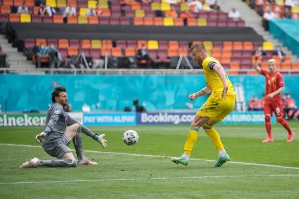 Andriy Yarmolenko of Ukraine shoots whilst under pressure from Stole Dimitrievski of North Macedonia during the UEFA Euro 2020 Championship Group C...