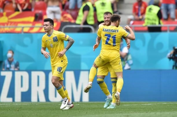 Andriy Yarmolenko of Ukraine celebrates with Oleksandr Karavaev after scoring their side's first goal during the UEFA Euro 2020 Championship Group C...