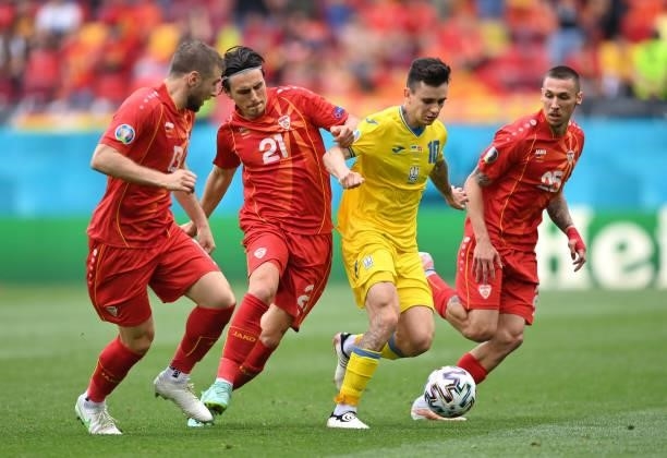 Mykola Shaparenko of Ukraine is challenged by Eljif Elmas of North Macedonia during the UEFA Euro 2020 Championship Group C match between Ukraine and...