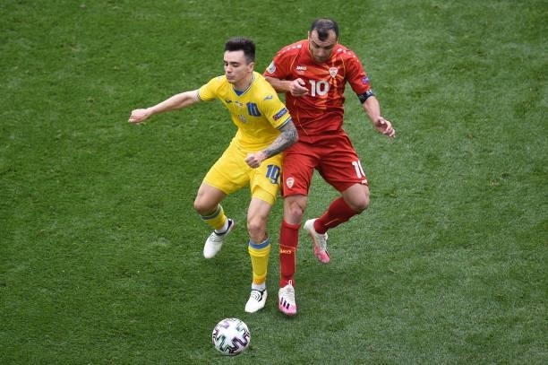 Mykola Shaparenko of Ukraine battles for possession with Goran Pandev of North Macedonia during the UEFA Euro 2020 Championship Group C match between...