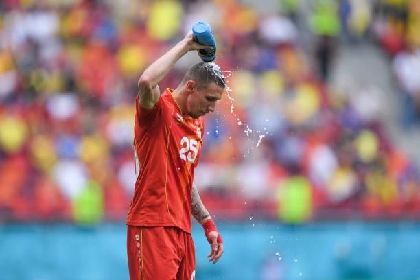 Darko Churlinov of North Macedonia pours water on his head during the UEFA Euro 2020 Championship Group C match between Ukraine and North Macedonia...