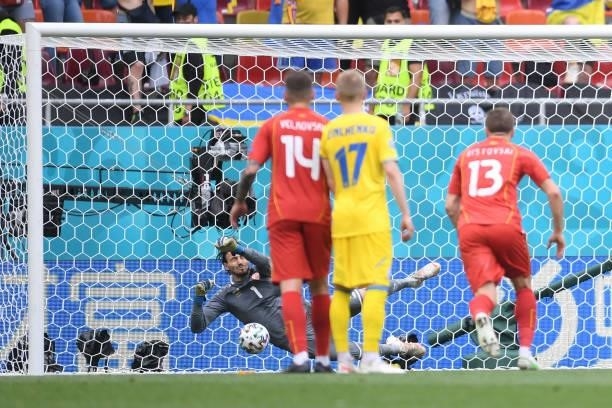 Stole Dimitrievski of North Macedonia saves a penalty taken by Ruslan Malinovskyi of Ukraine during the UEFA Euro 2020 Championship Group C match...