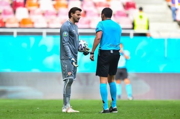 Stole Dimitrievski of North Macedonia interacts with Match Referee, Fernando Andres Rapallini during the UEFA Euro 2020 Championship Group C match...
