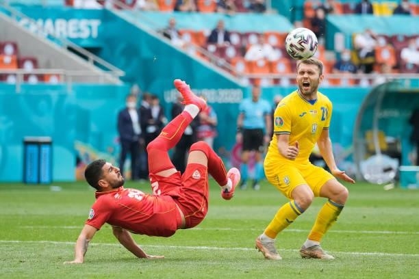 Daniel Avramovski of North Macedonia battles for possession with Oleksandr Karavaev of Ukraine during the UEFA Euro 2020 Championship Group C match...