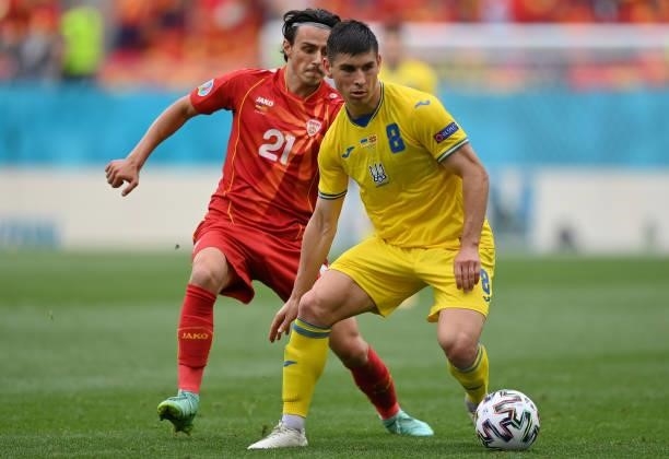 Ruslan Malinovskyi of Ukraine battles for possession with Eljif Elmas of North Macedonia during the UEFA Euro 2020 Championship Group C match between...