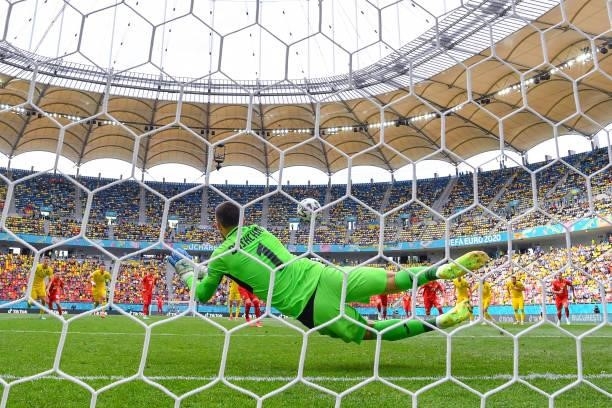 Georgiy Bushchan of Ukraine saves a penalty from Egzijan Alioski of North Macedonia during the UEFA Euro 2020 Championship Group C match between...