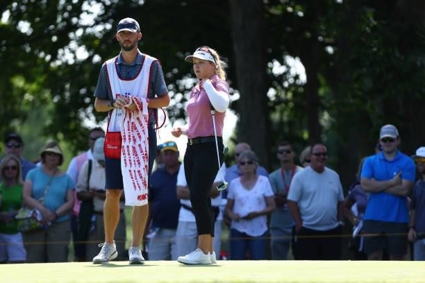Brooke Henderson of Canada with her caddie this week Everette Nini on the fifth green during round one of the Meijer LPGA Classic for Simply Give at...
