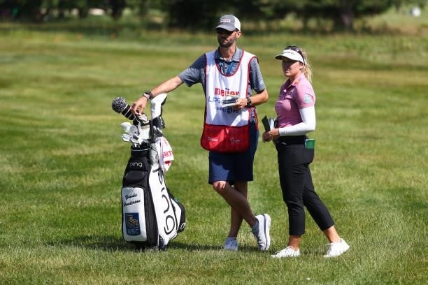 Brooke Henderson of Canada with her caddie this week Everette Nini on the sixth hole during round one of the Meijer LPGA Classic for Simply Give at...