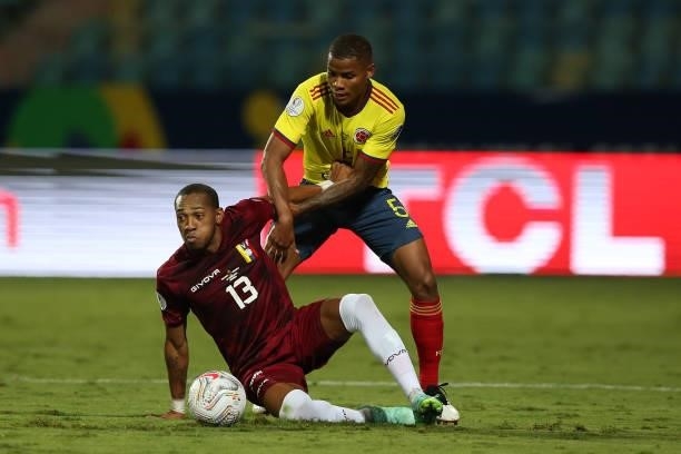 Wilmar Barrios of Colombia fights for the ball with Jose Martinez of Venezuela during a Group B match between Colombia and Venezuela as part of Copa...