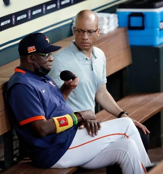 Manager Dusty Baker Jr. #12 of the Houston Astros is interviewed by Robert Ford before playing the Chicago White Sox at Minute Maid Park on June 17,...