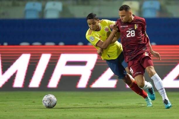 Luis Martinez of Venezuela fights for the ball with Luis Muriel of Colombia during a Group B match between Colombia and Venezuela as part of Copa...