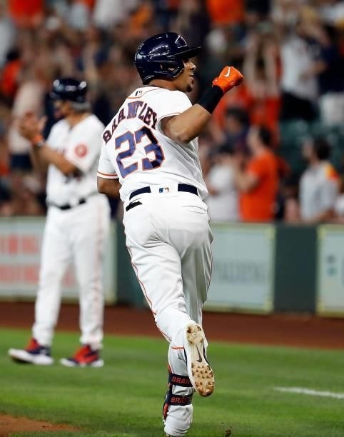 Michael Brantley of the Houston Astros hits a three-run home run in the first inning against the Chicago White Sox at Minute Maid Park on June 17,...
