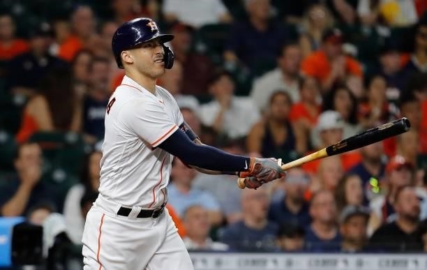 Carlos Correa of the Houston Astros hits a ground-rule double that scored Yuli Gurriel in the fourth inning against the Chicago White Sox at Minute...