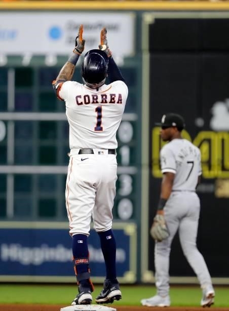 Carlos Correa of the Houston Astros stands reacts at second base after his ground-rule double that scored Yuli Gurriel in the fourth inning against...