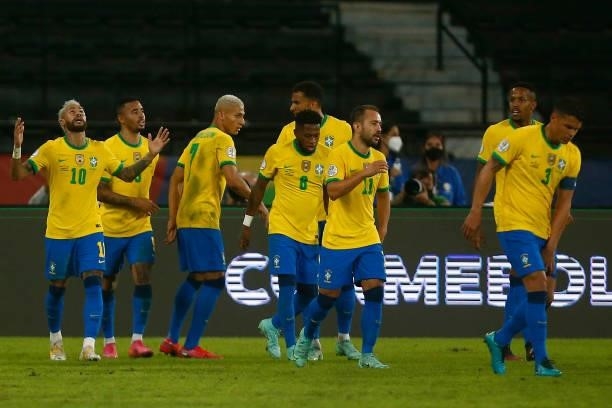 Neymar Jr. Of Brazil celebrates with teammates after scoring the second goal of his team during a match between Brazil and Peru as part of Group B of...