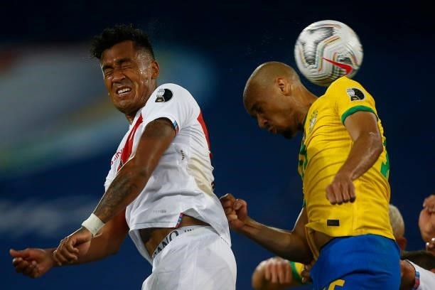 Fabinho of Brazil heads the ball against Renato Tapia of Peru during a match between Brazil and Peru as part of Group B of Copa America Brazil 2021...