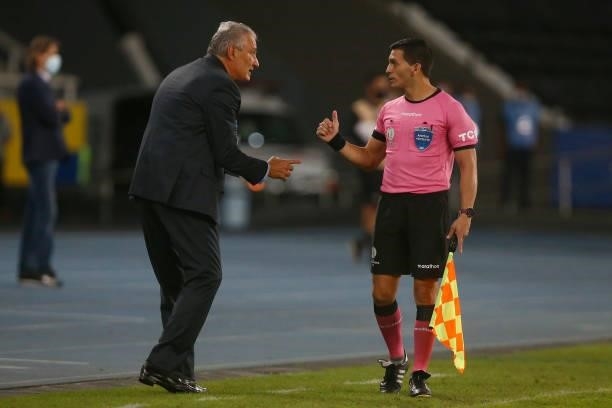 Tite head coach of Brazil talks to assistant referee Gabriel Chade during a match between Brazil and Peru as part of Group B of Copa America Brazil...
