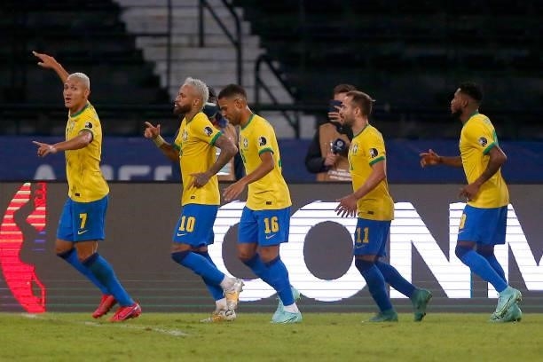 Richarlison of Brazil celebrates with teammates after scoring the fourth goal of his team during a match between Brazil and Peru as part of Group B...