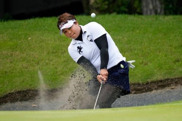 Eriko Tenra of Japan hits out from a bunker on the 6th hole during the first round of the Yupiteru Shizuoka Shimbun SBS Ladies at the Shizuoka...