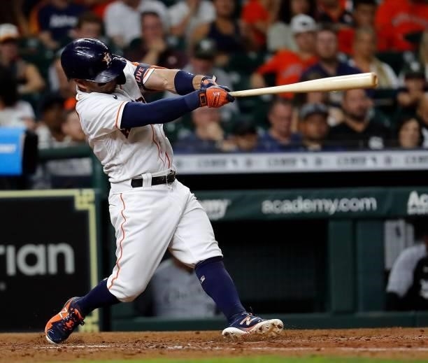 Jose Altuve of the Houston Astros hits a home run in the sixth inning against the Chicago White Sox at Minute Maid Park on June 17, 2021 in Houston,...