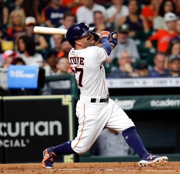 Jose Altuve of the Houston Astros hits a home run in the sixth inning against the Chicago White Sox at Minute Maid Park on June 17, 2021 in Houston,...