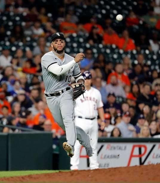 Yoan Moncada of the Chicago White Sox throws out Michael Brantley of the Houston Astros in the sixth inning at Minute Maid Park on June 17, 2021 in...